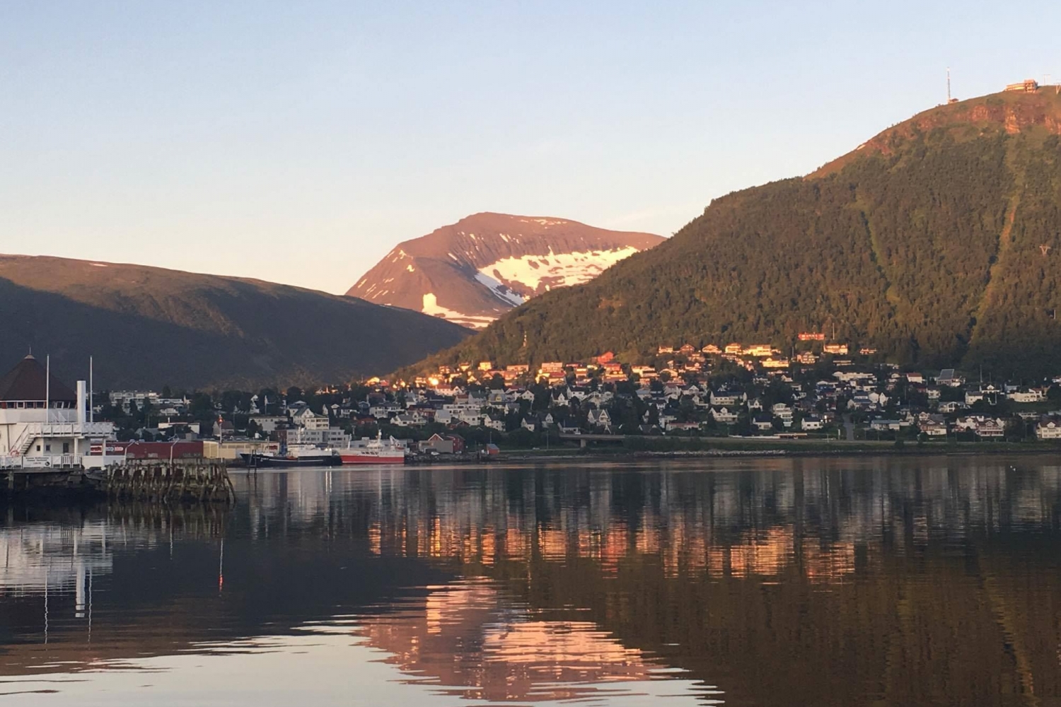 view from Tromsø city centre, clear sea and the Tromsdalstinden mountain