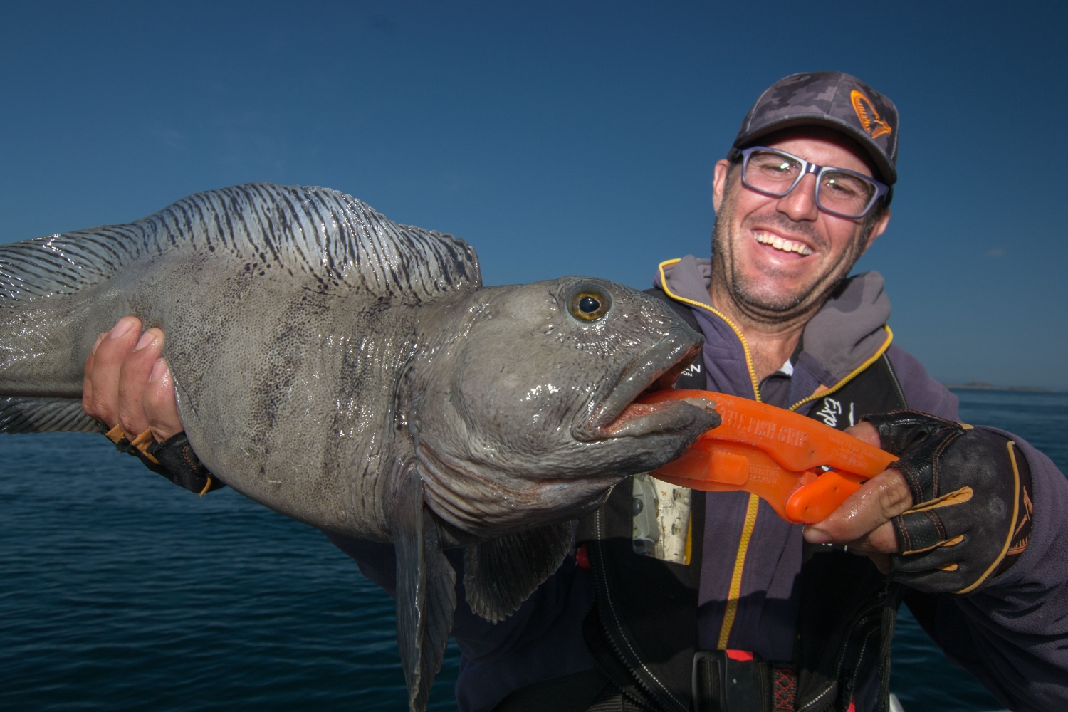 guest with a big fish on a fishing trip