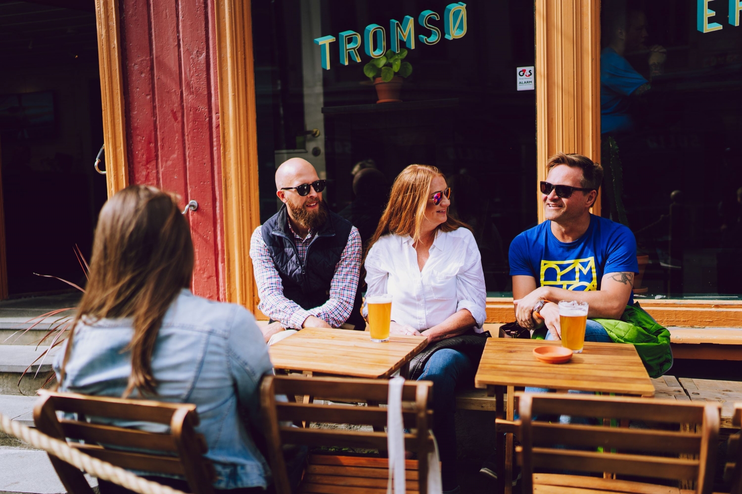 People hanging out in the sun outside Tromsø Mikrobryggeri