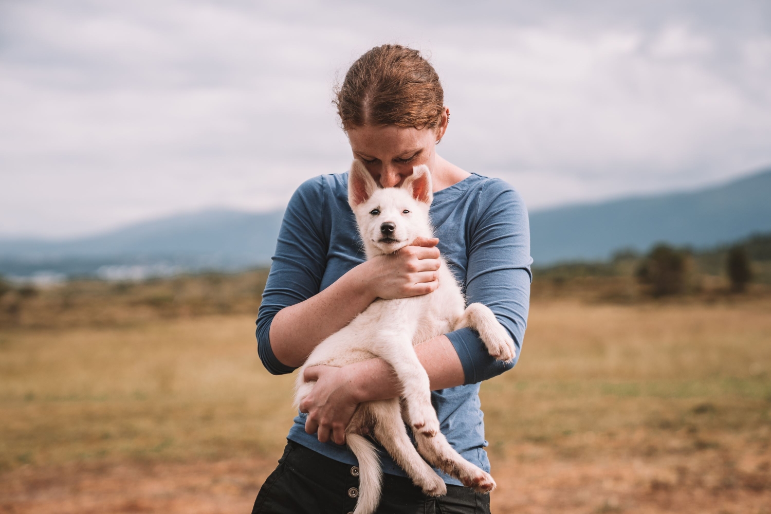 Lady holding a puppy