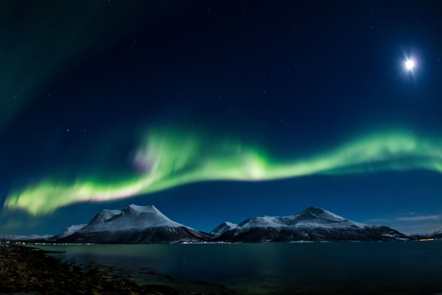 the northern lights over mountains