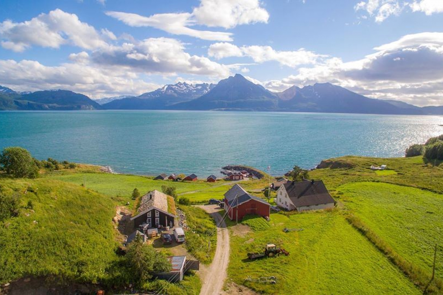 Drone photo view over Dyrøy Holiday, sea and mountains