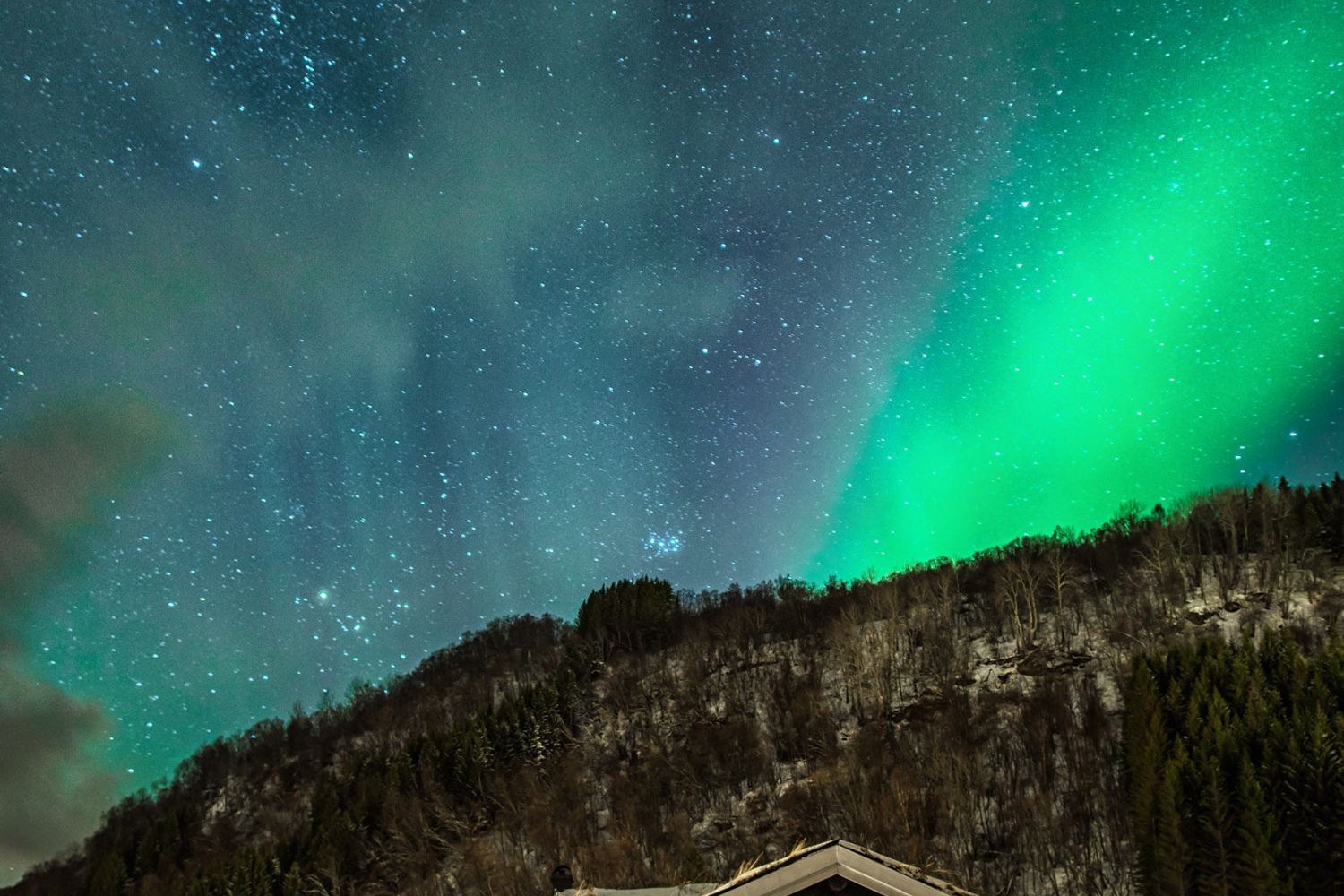 Northern Lights above a house