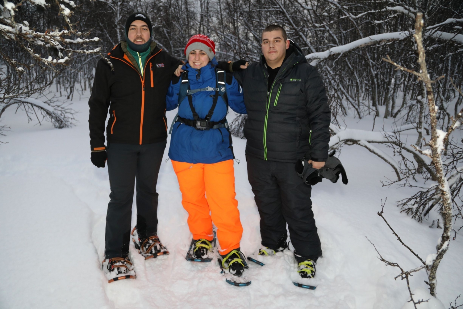 three people snowshoeing