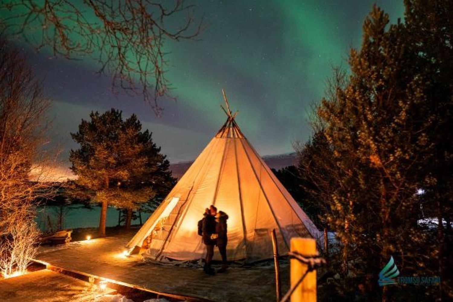 lavvu tent and northern lights, couple kissing