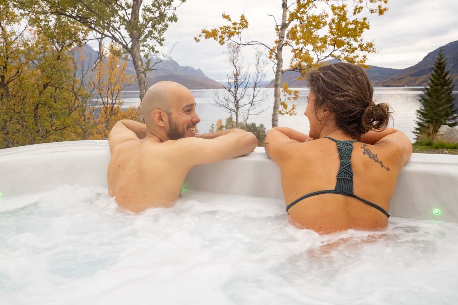 two people sitting in a jacuzzi