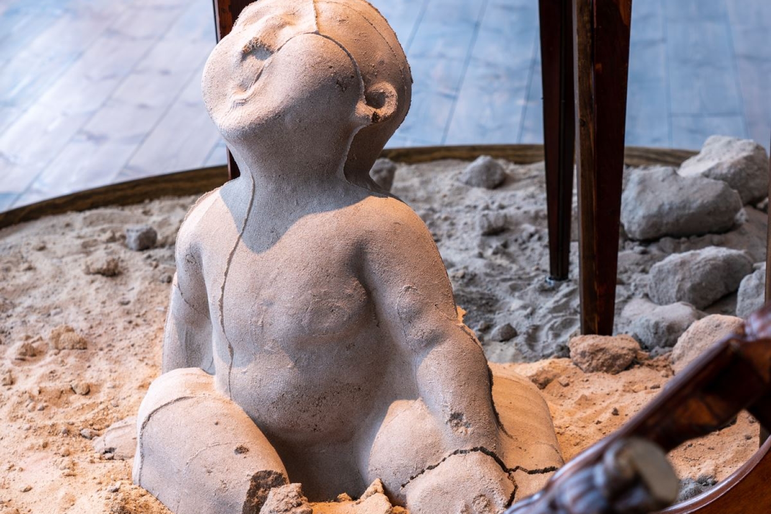 Crying child made of sand