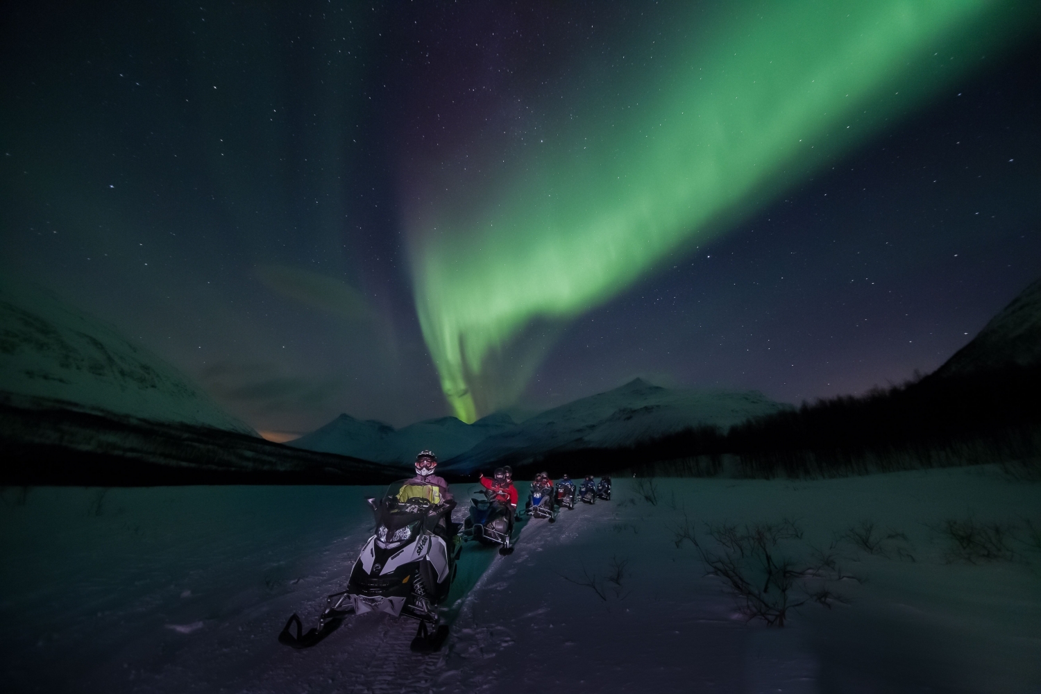 Snowmobile and northern lights