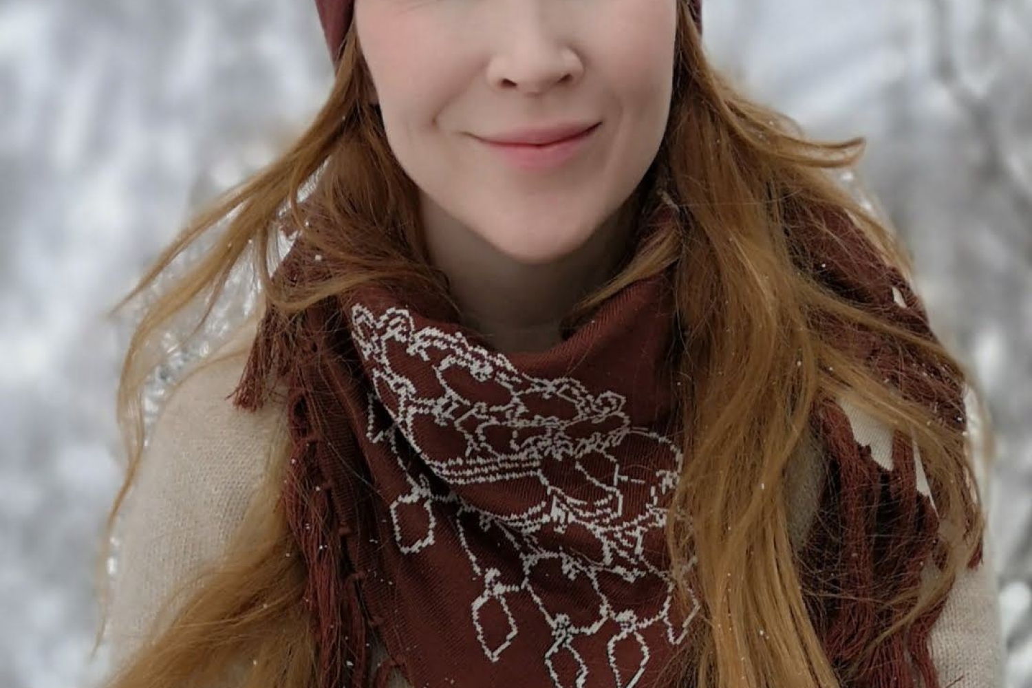 Girl wearing sami design beanie, scarf and gloves