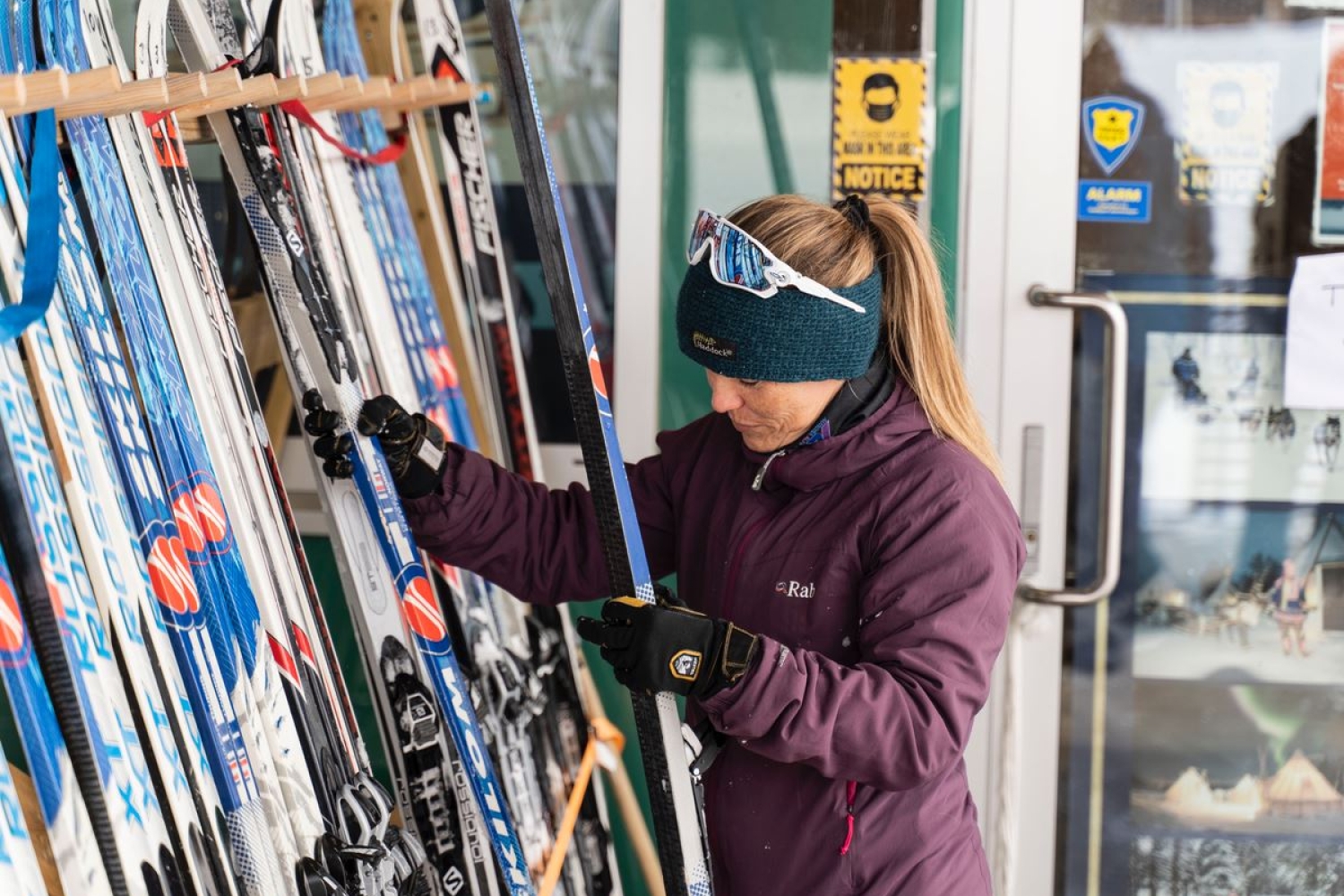 a person picking out her skis